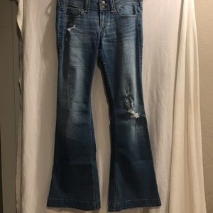 Hollister medium washed, wide legged, ripped jeans
